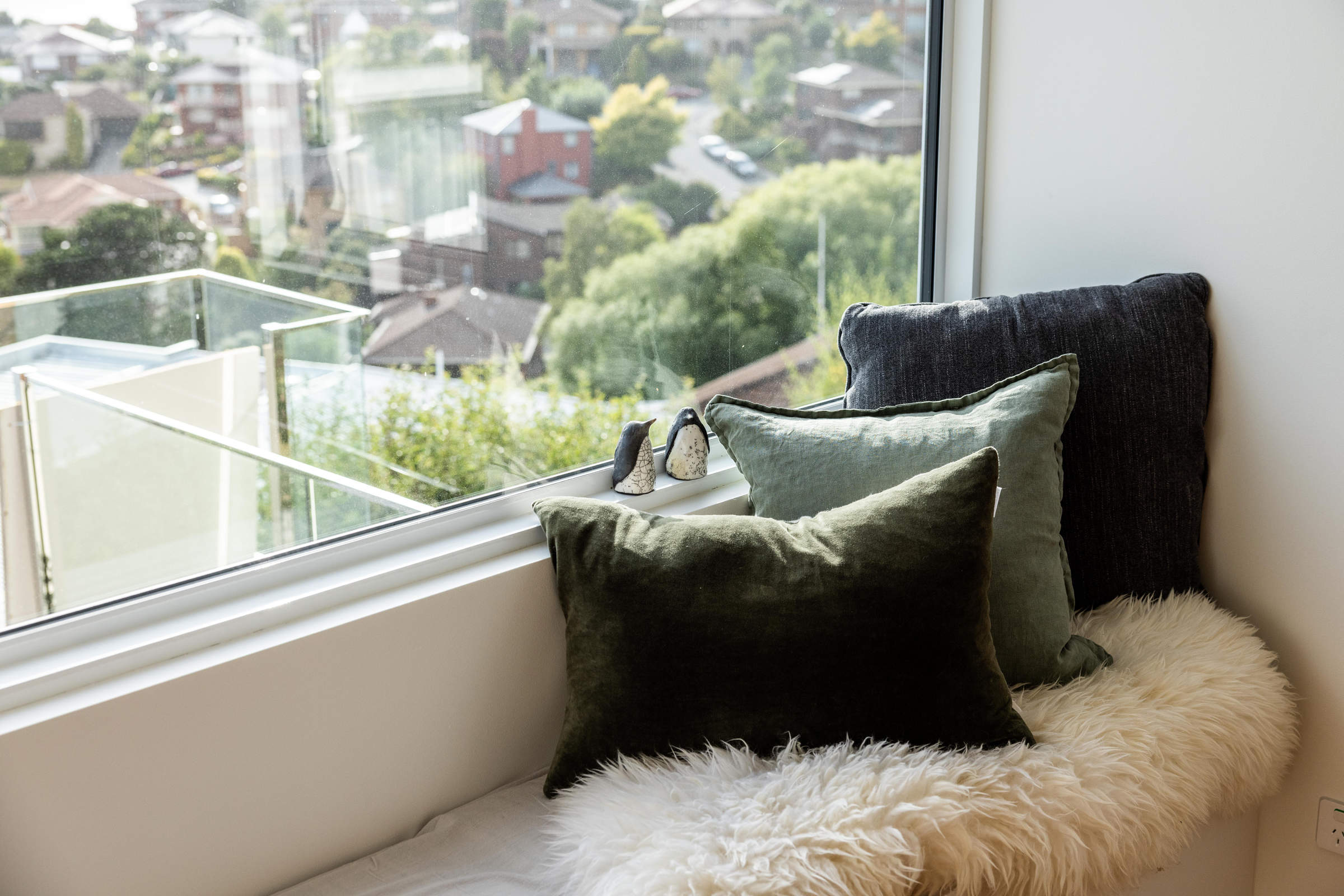 A lovely element of the lifestyle renovation of this 1970s house is the new window seat to take advantage of the water view and look out over the new deck extension. Photo: Jordan Davis.